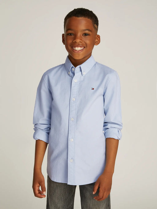 Boy modelling the Tommy Hilfiger oxford shirt.