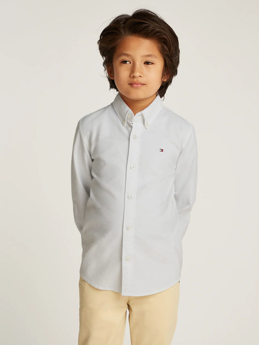 Boy wearing the Tommy Hilfiger oxford shirt.