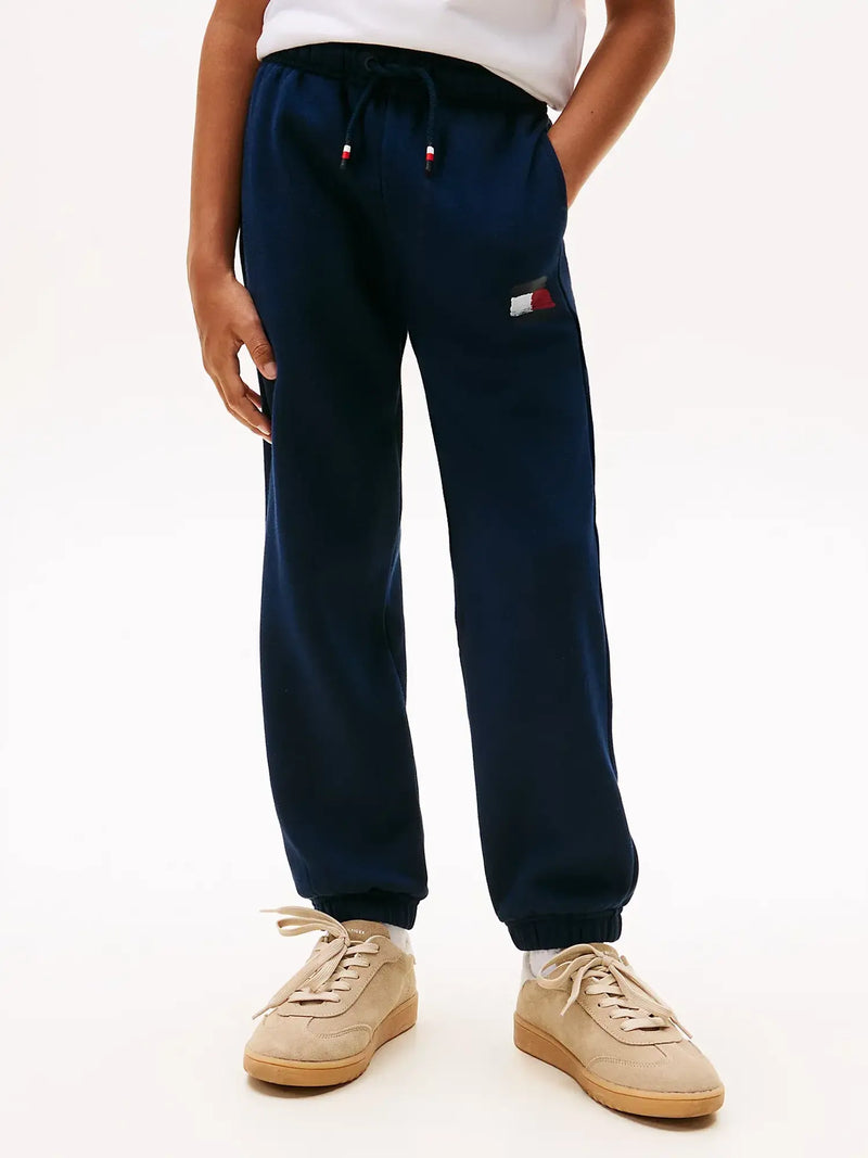 Closer view of the Tommy Hilfiger painted logo joggers.