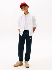 Boy wearing the Tommy Hilfiger painted logo joggers.