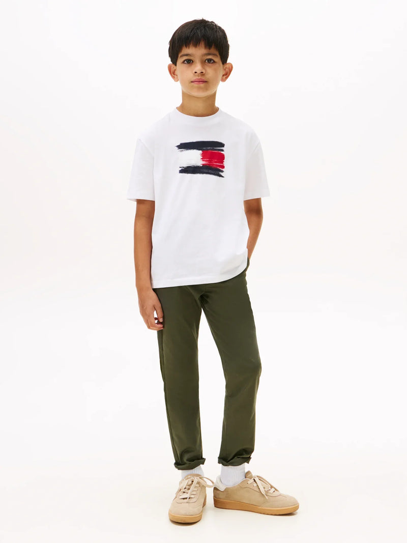 Boy modelling the Tommy Hilfiger painted logo t-shirt.