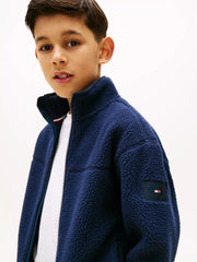 Closer look at the Tommy Hilfiger polar fleece showing detail of the logo patch on the sleeve.