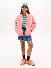 Girl modelling the Tommy Hilfiger polar fleece.