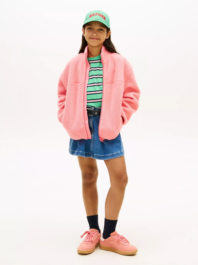 Girl modelling the Tommy Hilfiger polar fleece.