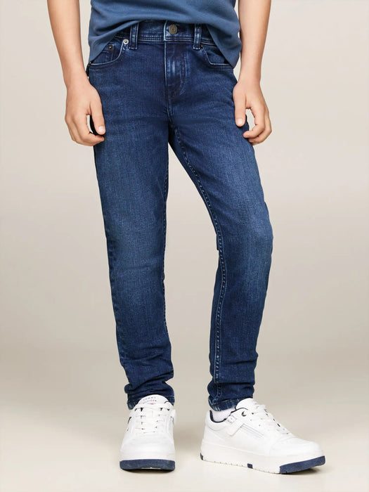 Boy wearing the Tommy Hilfiger scanton skinny fit jeans.