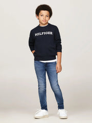 Boy wearing the Tommy Hilfiger scanton y jeans.