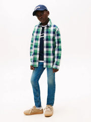 Boy modelling the Tommy Hilfiger scanton y jeans.