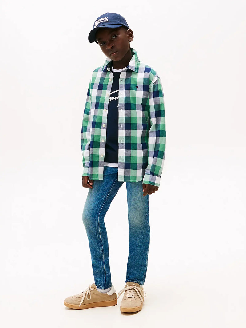 Boy modelling the Tommy Hilfiger scanton y jeans.