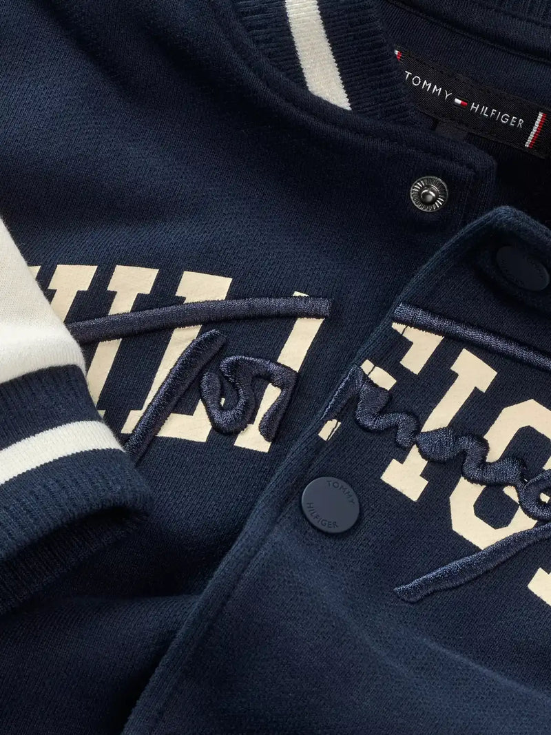 Tommy Hilfiger navy jacket with embroidered logo.