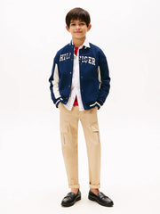 Boy modelling the Tommy Hilfiger script logo jacket.