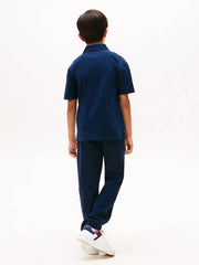 Back of the Tommy Hilfiger script logo track bottoms.