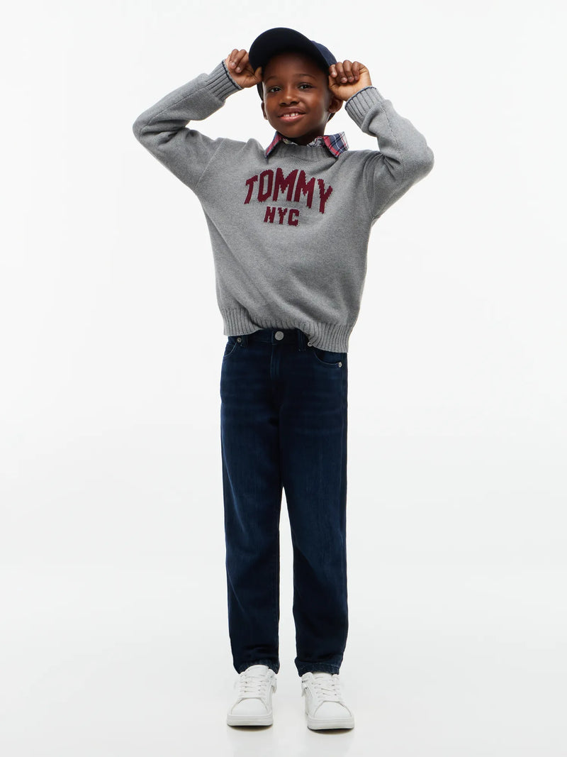 Boy modelling the Tommy Hilfiger straight leg jeans.