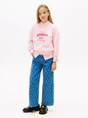 Girl wearing the Tommy Hilfiger sweatshirt.