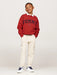 Boy modelling the Tommy Hilfiger varsity sweatshirt.