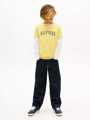 Boy wearing the Tommy Hilfiger varsity t-shirt.