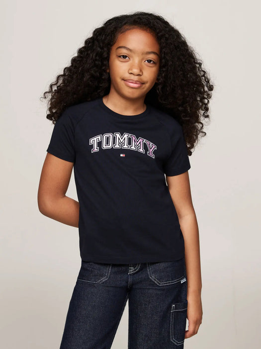 Girl wearing the Tommy Hilfiger varsity t-shirt.