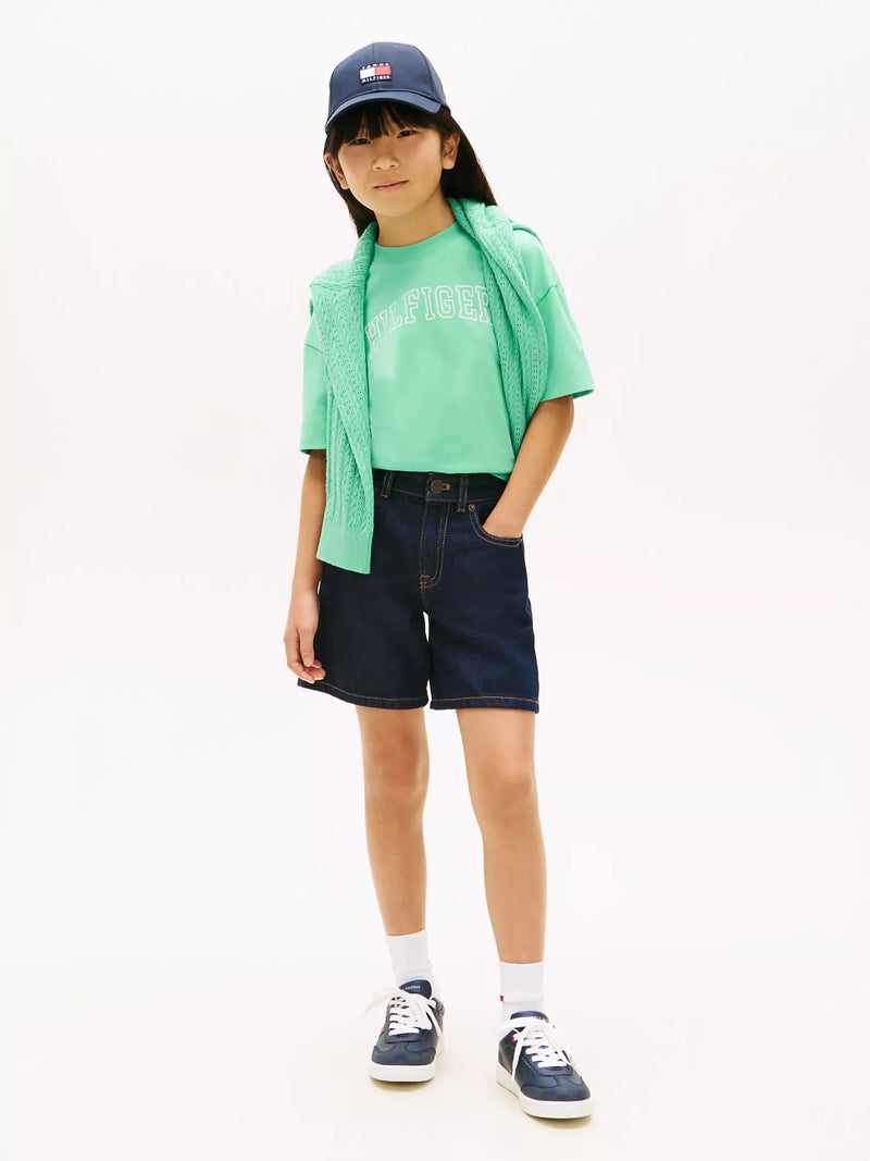 Girl wearing the Tommy Hilfiger varsity t-shirt.