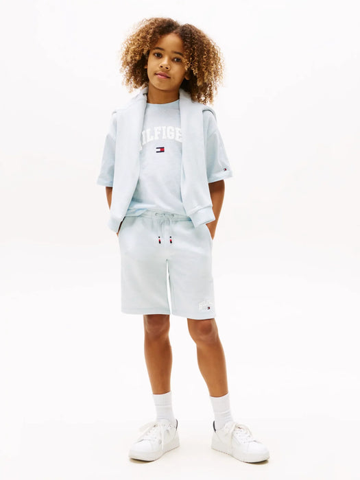 Boy modelling the Tommy Hilfiger varsity track shorts.