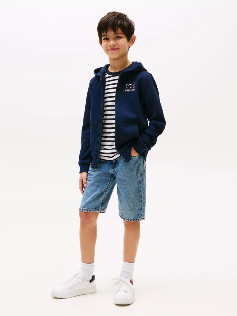Boy wearing the Tommy Hilfiger zip up hoodie.