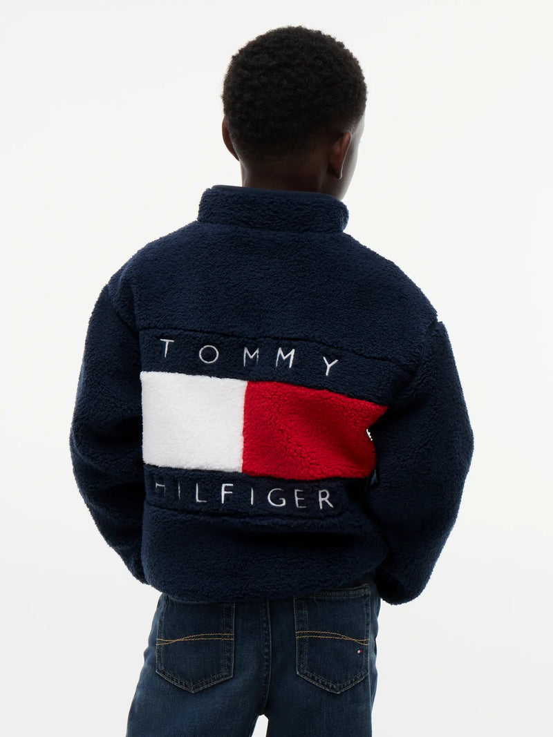 Tommy Hilfiger polar fleece with bold flag logo on the back.