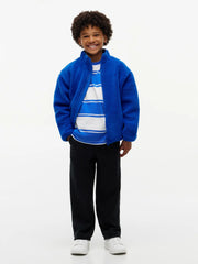 Boy in blue polar fleece by Tommy Hilfiger.