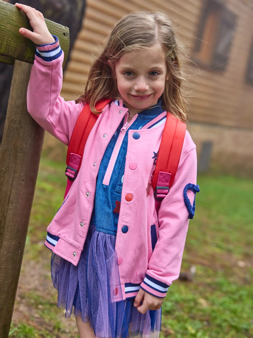 Smiling Girl modelling the Tuc Tuc bomber jacket.