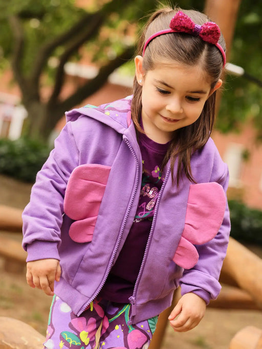 Girl modelling the Tuc Tuc butterfly hoodie.