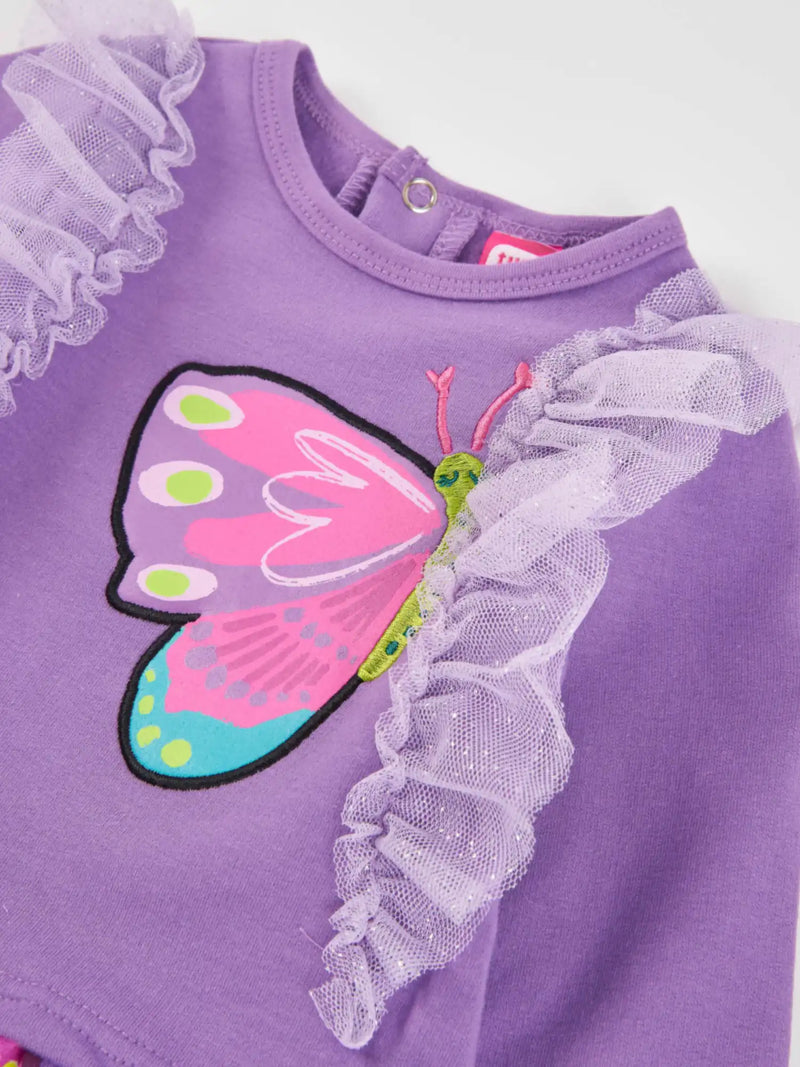 Closer look at the Tuc Tuc butterfly dress showing detail of the frilled tulle seams at the shoulders.