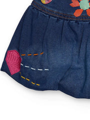 Tuc Tuc denim skirt with embroidered designs.