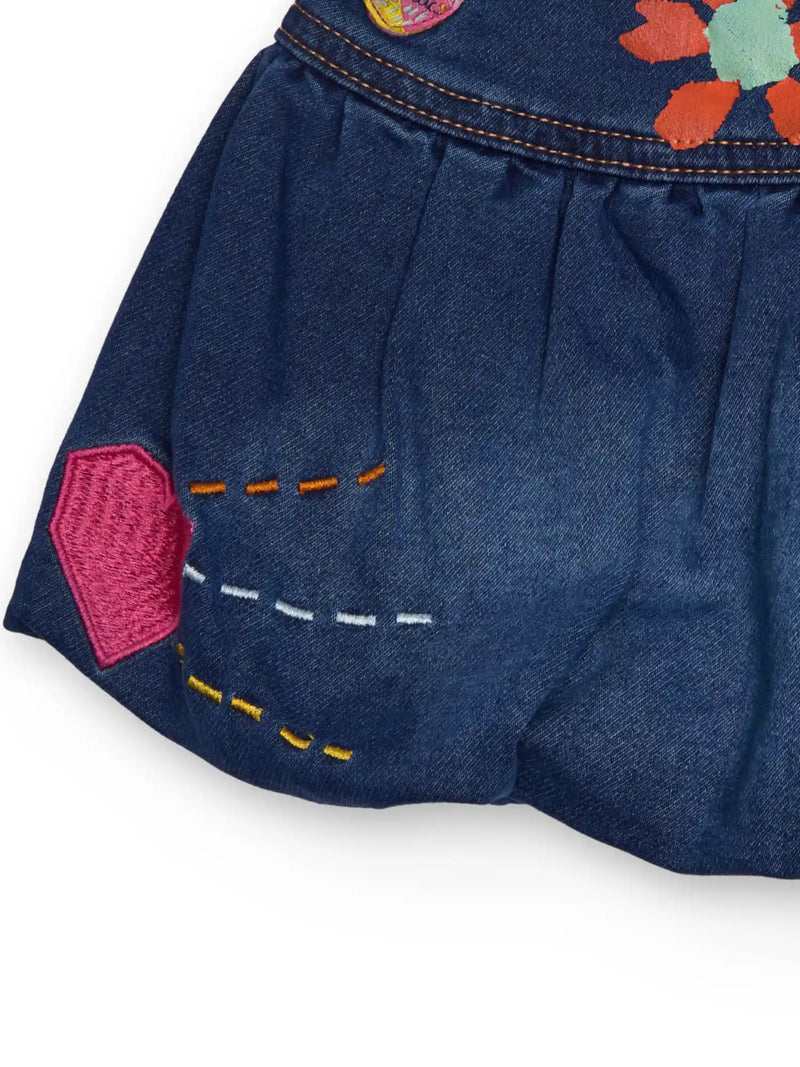 Tuc Tuc denim skirt with embroidered designs.