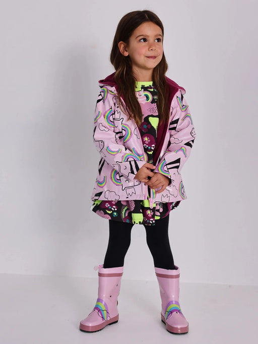 Tuc Tuc pink glitter raincoat, modelled by girl.