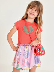 Girl modelling the Tuc Tuc heart dress.