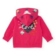 Tuc Tuc zip up hoodie with heart print on the back.