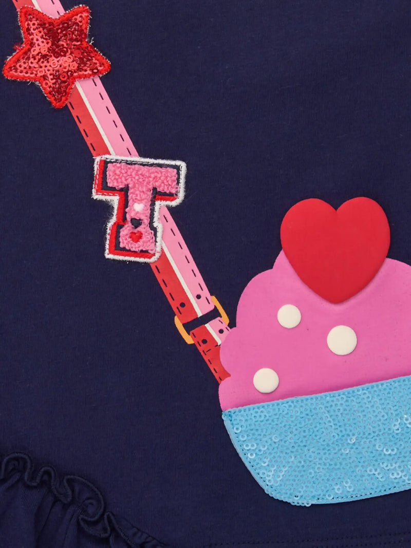 Closer look at the Tuc Tuc leggings set showing detail of the sequin cupcake design