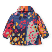 Rear view of the Tuc Tuc patterned coat.