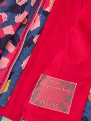 Tuc Tuc patterned coat with bright red microfleece lining.