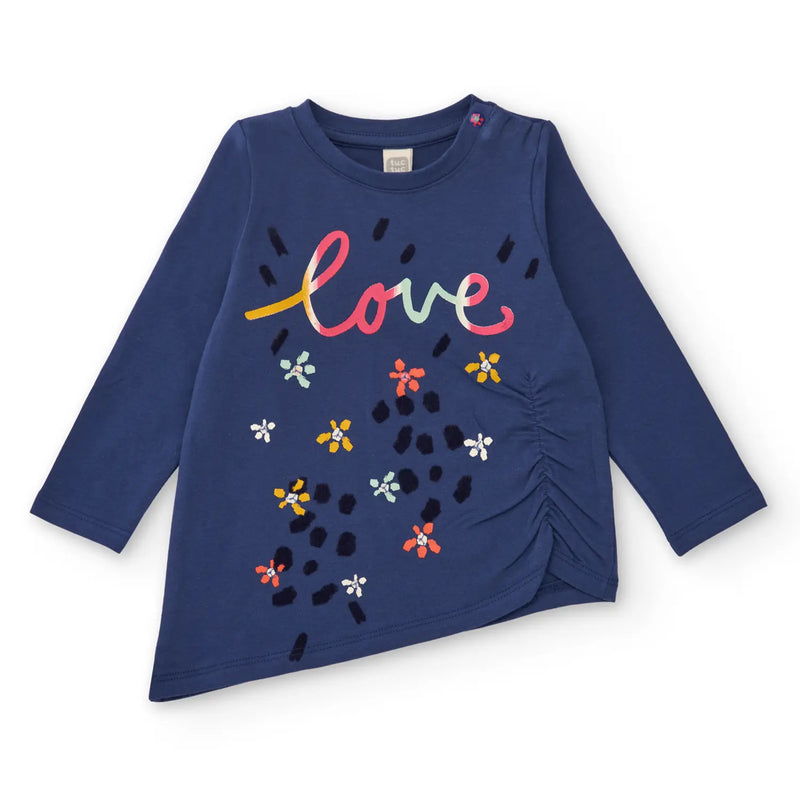 Tuc Tuc long sleeve top with asymmetric hem.