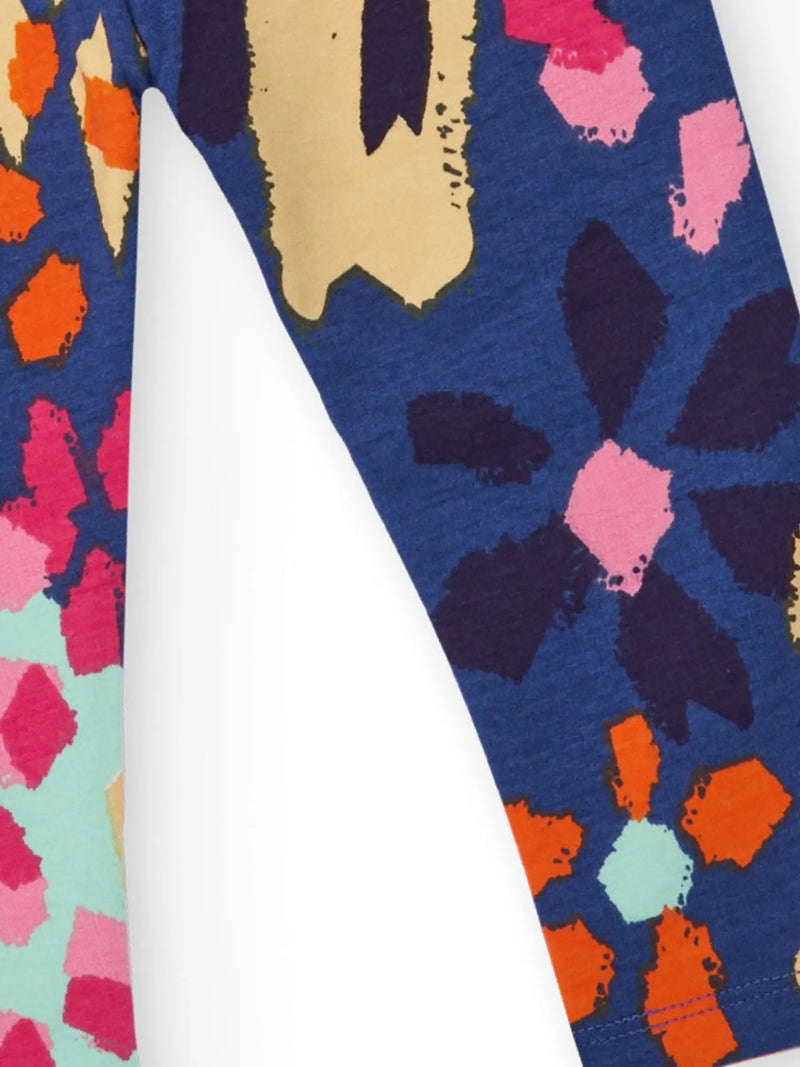 Closer look at the Tuc Tuc printed leggings showing detail of the painted floral pattern