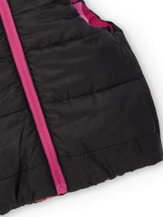 Girl's reversible gilet with pink zipper.