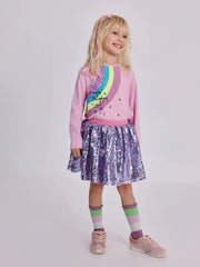 Girl modelling the Tuc Tuc sequin skirt set.