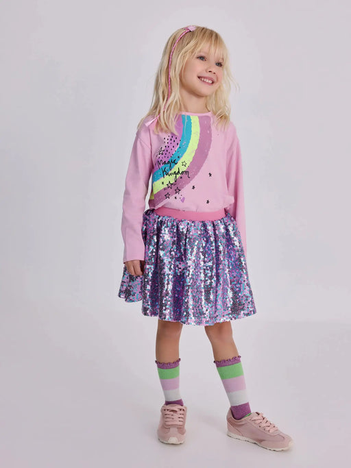 Girl modelling the Tuc Tuc sequin skirt set.