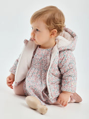 Baby girl wearing the Tutto Piccolo bouquet coat.