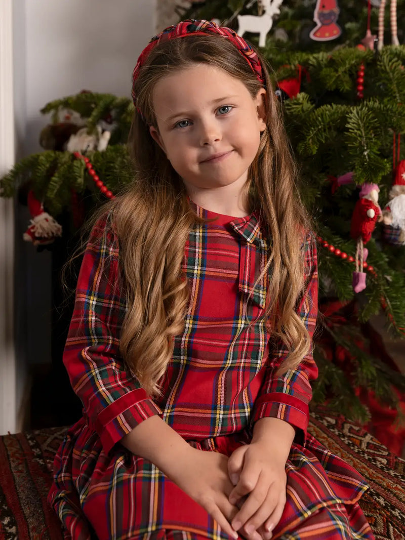 Girl modelling the Tutto Piccolo concierto dress & tights.