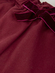 Closer look at the girl's burgundy shorts.