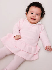 Baby girl wearing the Tutto Piccolo vida dress & tights.