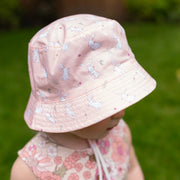 Baby girl wearing the Ziggle bunnies sun hat.
