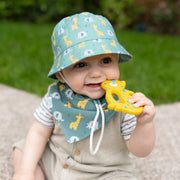 Baby boy in green giraffe & elephant sun hat by Ziggle.