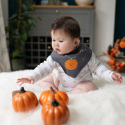 Baby boy wearing the Ziggle my l'il pumpkin bib.