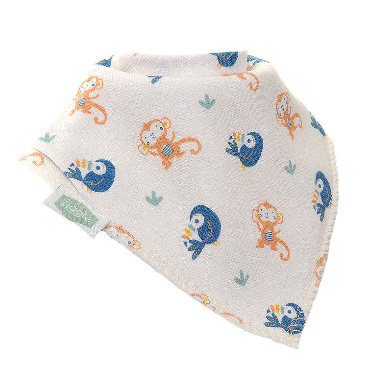 White bandana bib decorated with monkeys and toucans.