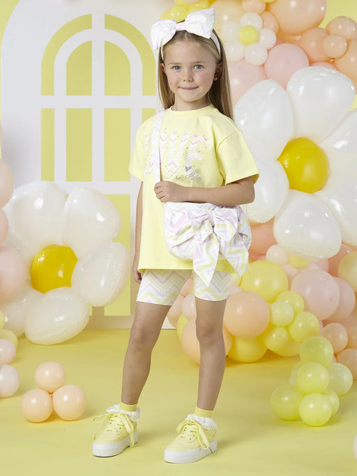 Smiling girl modelling the A Dee loraine shorts set.